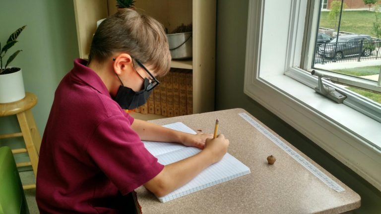student practicing writing skills